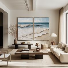 a living room with two paintings on the wall