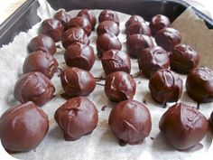 there are many chocolate balls on the baking sheet