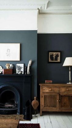 a living room with a fire place next to a fireplace