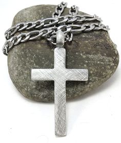 This rustic cross pendant is paired with a tough, durable and high-quality stainless steel Figaro chain. The bulky chain resists moisture and oxidizing. The pendant design is double-sided and cast in lead-free pewter. Since we finish each pendant by hand, please expect small unique variations in surface texture. A wide variety of chain lengths from 16 to 42 inches (40.6cm - 106.6cm) may be selected during checkout. The chain's width is 6mm, which is about 0.23 of an inch, and the chain's thickne Stainless Steel Cross Necklace With Chain, Jewelry Rustic, Rustic Cross, Necklace Christian, Mens Cross Necklace, Mens Crosses, Rustic Jewelry, Baby Jewelry, Figaro Chains