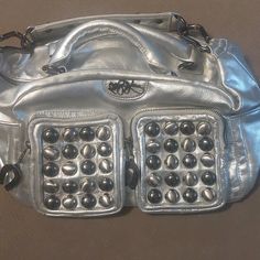 Betsey Johnson Silver Leather Vintage 90s Purse. Can Use Single Strap Or Detach And Use Double Handles. Stone Details Are All Intact, None Missing. Zippers All Function. Both Sides Have Snap Close Pockets. Inside Is Brown/Blush With Silver Details. Excellent Condition. All Tags Intact. Horseshoe Detail Is On Large Zipper And Both Front Pockets. Make Me An Offer.... 90s Betsey Johnson, Brown Blush, Vintage Betsey Johnson, Betsey Johnson Bags, Pretty Bags, Leather Purse, Cute Photos, Fun Bags, Dream Wardrobe