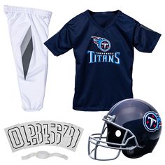 PRICES MAY VARY. 100% Polyester Imported TENNESSEE TITANS UNIFORM SET: This Tennessee Titans kids uniform set is the perfect gift for any young fan to dress up like their favorite NFL pros! SET INCLUDES: Set comes complete with helmet, jersey, uniform pants, chinstrap, and iron-on numbers for a head-to-toe official look that kids will love GREAT COSTUME FOR ANY OCCASION: Kids will love dressing up like their favorite players whether they are playing on gameday, dressing up for Halloween, or just White Sporty Sets For Sports Events, White Sports Sets For Sports Season, White Sports Sets, Blue Sportswear Training Set, Blue Sportswear Training Sets, Blue Sportswear Sets For Training, Sporty Blue Sets For Sports Events, Sporty Blue Training Sets, White Moisture-wicking Sportswear Sets