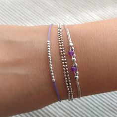 "Minimalist, wearable and delicate sterling 925 silver bracelet with natural amethyst gemstones of two strands for everyday wearing. Length: from 5,5\" to 8\" with 2\" 925 sterling silver extensor chain. Width: 2 and 3 mm 925 sterling silver beads and 3mm amethyst gemstones. Chain width: 0,66 mm. Handmade in Spain. Ideal for a gift to silver jewelry lovers. All our products are presented in a white organza bag. ♡ Made with love in Valencia ♡ ----------------------------- Discover the NICTE brace Stacked Beaded Bracelets, Miyuki Bracelet, Tiny Charm, Charm Chain, 925 Silver Bracelet, Silver Chain Style, Healing Jewelry, 925 Sterling Silver Chain, Strand Bracelet