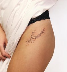 a close up of a person's stomach with flowers on it