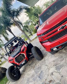 two red trucks parked next to each other