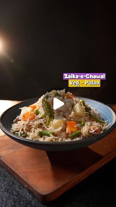 a bowl filled with rice and vegetables on top of a wooden cutting board