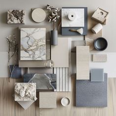 an assortment of different materials are arranged on the table top, including paper and other items