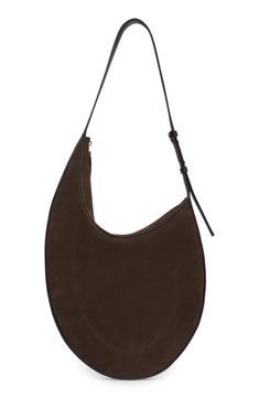 Minimalist styling lets the impeccable leather craftsmanship shine on this slim hobo made of velvety suede set off with smooth leather. Top zip closure Adjustable shoulder strap Leather Made in Italy Designer Handbags Modern Leather Hobo Bag With Suede Lining, Elegant Leather Hobo Bag With Suede Lining, Evening Suede Hobo Bag With Soft Leather, Luxury Suede Shoulder Bag With Zipper Closure, Elegant Suede Shoulder Bag With Zipper, Elegant Suede Shoulder Bag With Zipper Closure, Suede Set, Suede Hobo Bag, Shine On