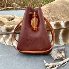 "Vegan Eco Leather Medicine Bag, Shaman Bag or Amulet Pouch to wear around your neck-or hang in your Car! A place for things that have Spiritual Meaning for you-your Sage,Crystals,or that pretty rock your 3 year old gave you.... 3 3/4\"deep 2 3/4\"wide Choice of 2 colors:- - -Black /Double Terminated Labradorite Crystal Point -Russet Brown/Red Agate and Baltic Amber Stones Please note these are natural Gemstones- each one is completely different...like snowflakes! BUY ANY 4 MEDICINE BAGS(VEGAN L Brown Portable Bag As Gift, Brown Travel Bag For Gift, Brown Coin Purse For Gifts, Brown Portable Coin Purse For Gift, Brown Portable Pouch For Gift, Portable Brown Coin Purse For Gift, Handmade Bags For Daily Use, Small Brown Bag For Gift, Small Brown Gift Bag