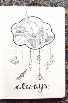 a notebook with an image of a castle in the sky and words always written on it