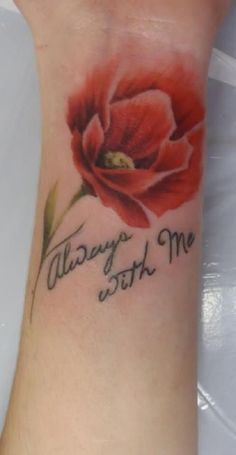 a red flower with the words always me written in cursive writing on it