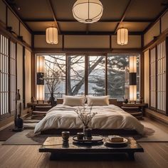 a large bed sitting inside of a bedroom next to two windows