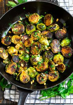 roasted brussel sprouts in a skillet with corn and parsley