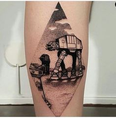 a tattoo on the leg of a person with a star wars character drawn on it