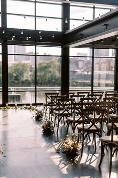 Indoor Wedding Ceremony with Floor-to-Ceiling Windows and Skyline View at The Bridge Building Event Spaces in Downtown Nashville Whimsical Wedding Ceremony, Blush Winter Wedding, Indoor Aesthetic, Aisle Arrangements, Riverfront Wedding, Rooftop Wedding Ceremony, Simple Classic Wedding, Modern Wedding Ceremony