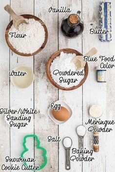 the ingredients for baking are shown in bowls and spoons on a white wooden table