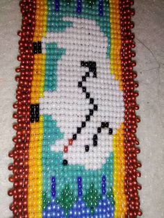 This Bracelet is 2 inches wide and 8 1/2 long. Length SNAP TO SNAP is 7 inches. The snap to snap length is what it is when it is closed around your wrist. Beads are all Pearl and Luster Iris size 11 Czech Seed Beads. It was handmade by me. The White Buffalo Totem is Sacred to many of us. Please take a close look at my work. I try to make my items as close to perfect as I can get. Thank You So Very Much for your Interest!  Lori Miller Bohemian White Rectangular Bracelets, Bohemian White Rectangular Bracelet, White Bohemian Rectangular Bracelet, Southwestern Style White Beads As Gift, Southwestern White Beads For Gift, Southwestern Style White Beads For Gift, White Beaded Southwestern Bracelet, White Southwestern Beaded Bracelet, Powwow Beadwork