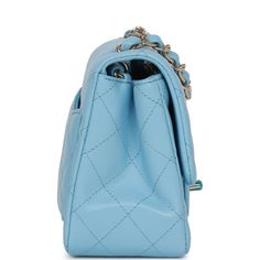 This Mini Square flap bag is in blue lambskin with light gold tone hardware and has a front flap with signature CC turnlock closure, rear half moon pocket and single interwoven blue leather and light gold tone chain link shoulder/crossbody strap. The interior is lined in blue leather and features a zipper pocket with Chanel pull and an open pocket below. Collection: 22S Origin: France Condition: Pristine; new or never Accompanied by: Chanel box, Chanel dustbag, carebook, ribbon, felt Measurements: 6.5" width x 5" depth x 3" height; 22" strap drop Chanel Mini Square, Chanel Box, Chanel Mini, Trending Handbag, Dior Shoes, Somali, Vuitton Bag, Sierra Leone, Fendi Bags