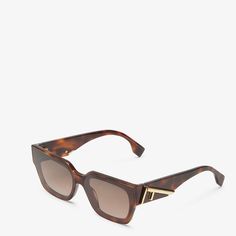 Rectangular Fendi First eyeglasses in Havana acetate. Temples with oversize diagonal F motif in gold-colored metal. Brown gradient lenses. Made in Italy Fendi First, Closet Organizer, Acetate Sunglasses, Brown Gradient, Glasses Fashion, Havana, Access Denied, Gold Color, Lenses