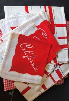 several red and white christmas napkins on top of each other