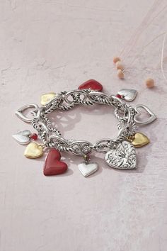 More hearts to love! Chain-linked stretch bracelet is circled with heart charms in versatile, two-tone metals with pops of red. Elastic Bracelet, Nature Bracelets, Metal Charm, Coldwater Creek, Bracelet Silver, Heart Charm Bracelet, Stretch Bracelet, Silver Heart, Stretch Bracelets