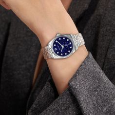 The classic and elegant Timeless Classic watch, the dial is made of deep blue and unique shining luster of blue sandstone, creating a mysterious and romantic starry sky on the wrist; the stainless steel case is paired with charming diamonds, echoing the starry dial, showing a unique fashion taste. Case: 31mm and 36mm steel case with polished and satin finish Waterproofness:10ATM Swimming is allowed, but only for shallow swimming (Do not operate the watch handle head in water or when the watch is Elegant Blue Watch With Metal Dial, Elegant Blue Diamond Watch, Luxury Blue Watches For Evening, Elegant Blue Watches For Gifts, Luxury Blue Evening Watch, Elegant Blue Diamond Watch With Round Dial, Timeless Blue Diamond Watch, Blue Timeless Diamond Watch, Head In Water