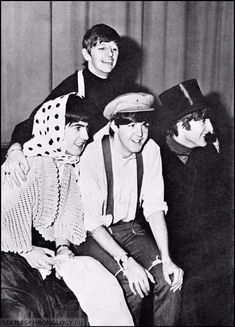 three young men are posing for the camera