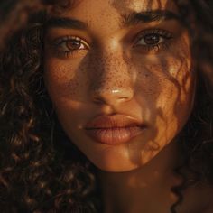 a woman with freckles on her face looking at the camera while she's close up