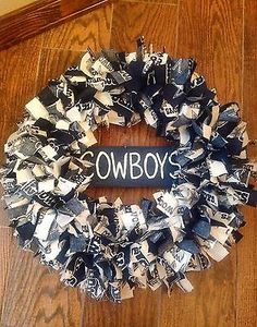 a wreath made out of newspaper strips with the word cowboys written on it in black and white