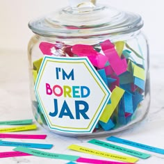 i'm bored jar filled with colorful colored paper and stickers on the side