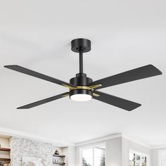 a black ceiling fan in a white room