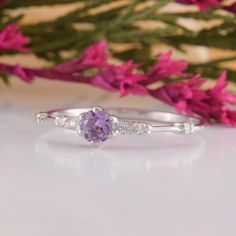 Womens Amethyst Promise Ring, Amethyst Silver Ring, Unique Promise Ring, Dainty Engagement Ring, Amethyst Jewelry, Silver Promise Ring WE OFFER UNLIMITED PERIOD INSTALLMENTS PLAN This is a beautiful, stunning, feminine ring that works well for all occasions, styles, and ages. You will love it! Ring information: Main stone: Amethyst Approximate size: 4.0mm Accent stones: Cubic zirconia Approximate size: 1.75mm (6 stones) Metal type: Silver Metal stamp: 925 sterling silver Installment Payments We Purple Amethyst Diamond Ring, Purple Amethyst Diamond Ring With Prong Setting, Purple Sapphire Promise Ring With Center Stone, Dainty Amethyst Ring With Prong Setting, Purple Crystal Promise Ring, Lavender Crystal Promise Ring, Purple Amethyst Promise Ring In Fine Jewelry Style, Purple Amethyst Solitaire Ring For Promise, Purple Amethyst Birthstone Ring With Gemstone Accents