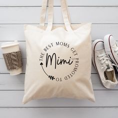 a tote bag with the words, best mom's getty and coffee next to it