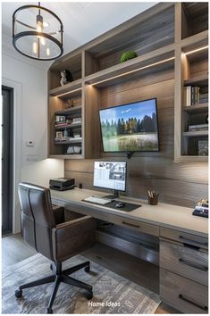 a home office with built in shelving and desk