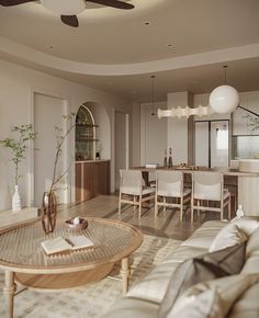 a living room filled with furniture and a ceiling fan