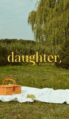 a picnic blanket and basket on the ground in front of a willow tree with text that reads, daughter