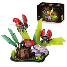 the ladybug plant is made out of legos and has flowers on it