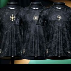 three black shirts with gold designs on them are shown in front of a green and yellow background