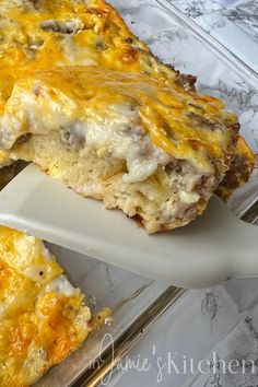 a cheesy casserole is cut into pieces