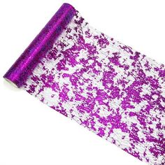 a roll of purple and white glitter paper