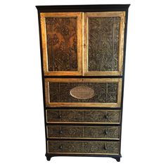 an old wooden cabinet with carvings on the doors and drawers is shown against a white background