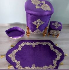 purple and gold furniture set with matching foot stools