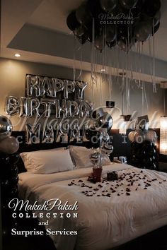 a bedroom decorated with balloons and streamers