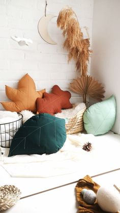 several decorative pillows are arranged on the floor