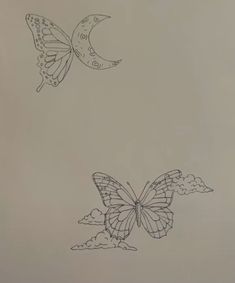 two butterflies flying in the sky next to each other on a sheet of white paper