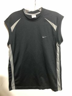 Vintage Nike Black And Gray Sleeveless Shirt Medium. Condition is Pre-owned. Shipped with USPS First Class Package. Nike Black Sleeveless Top, Nike Sporty Sleeveless Tops, Nike Sporty Sleeveless Vest, Sporty Sleeveless Nike Top, Black Short Sleeve Sports Tank Top, Sleeveless Cotton Nike Top, Nike Sleeveless Sports Vest, Nike Casual Sleeveless Vest, Nike Black Sleeveless Tank Top