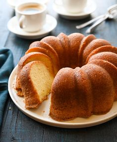 a bundt cake on a plate with one slice cut out