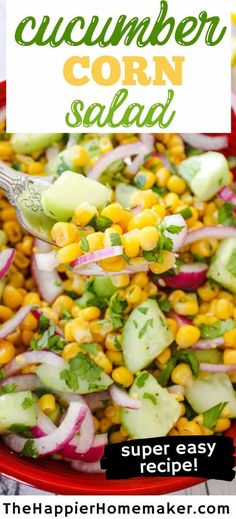 a red bowl filled with cucumber corn salad on top of a white table