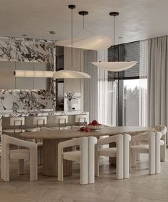 an elegant dining room with marble walls and flooring, along with modern lighting fixtures