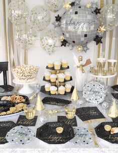 a table topped with lots of cupcakes and desserts covered in confetti